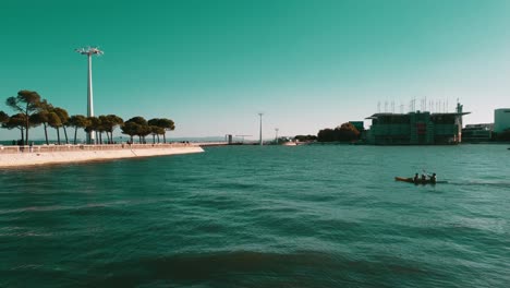 People-kayaking-In-Beautiful-Park-Of-Nations,-Calm-Water,-Lisbon-Capital-Of-Portugal
