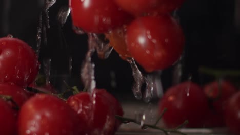 close-up-shot-of-a-bunch-of-tasty-fresh-red-ripe-cherry-tomatoes-being-rinsed