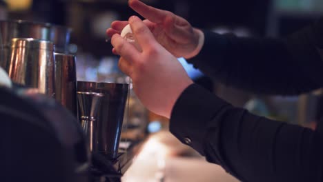 Bartender-is-breaking-the-egg-for-the-cocktail