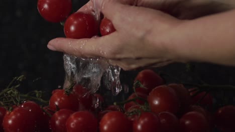 close-up-of-hands-rinsing-nutrient-rich-cherry-tomatoes-under-clean-water