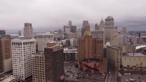 Skyscrapers-and-streets-of-Detroit,-aerial-fly-forward-shot
