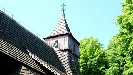 View-of-famous-cross-and-steeple-on-top-of-wooden-Polish-church-on-St