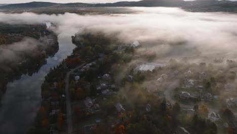 Aerial-View-Of-Foggy-Neighborhood-In-Sherbrooke,-Quebec,-Canada-In-Autumn---drone-shot