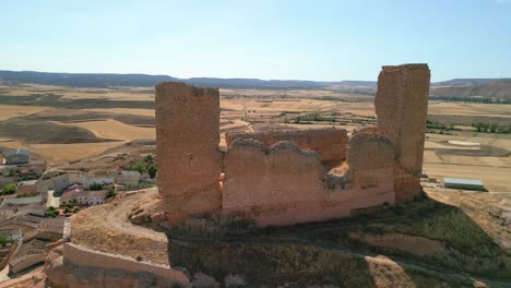 close-up-Aerial-images-of-ruined-medieval-castle-of-Montuenga-in-Soria-Flight-around-empty-environment-without-people-arid-Europe