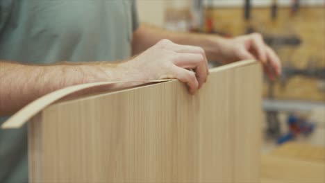 Carpenter-placing-white-oak-veneer-over-plywood-end-grain