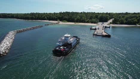 The-Washington-Island-Car-Ferry-approaches-the-pier-at-Northport,-Wisconsin-located-on-the-far-north-shore-of-the-Door-County-Peninsula-located-between-Lake-Michigan-and-the-bay-of-Green-Bay