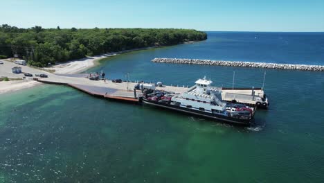 The-Washington-Island-Car-Ferry-arrives-at-the-pier-at-Northport,-Wisconsin-located-on-the-far-north-shore-of-the-Door-County-Peninsula-located-between-Lake-Michigan-and-the-bay-of-Green-Bay