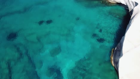Rocks,-cliffs-and-turquoise-sea-at-Sarakiniko-beach,-Milos-Island-in-the-Cyclades-in-Greece