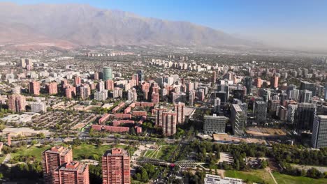 Aerial-view-over-Santiago-de-Chile-main-residential-part-of-the-city-Las-Condes-on-a-sunny-day