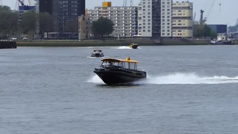 A-water-taxi-rushes-into-the-harbor-to-take-passengers-to-their-destination