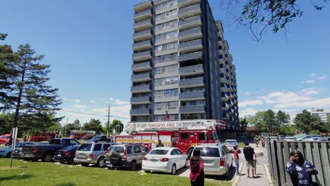 Tall-apartment-complex-with-Fire-engine-outside---Steady-shot