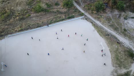 Group-of-kids-playing-soccer-in-Mexico-in-the-evening