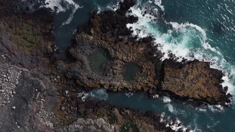 Top-down-of-wild-volcanic-shore-of-Reykjanes-peninsula-with-tide-pools