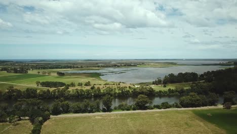 Aerial-footage-of-the-Snowy-River-and-adjacent-Lake-Wat-Wat-near-Marlo,-in-Gippsland,-Victoria,-Australia,-December-2020
