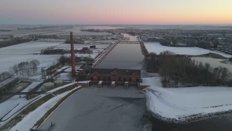Netherlands-in-morning-with-old-water-pumping-station-in-Friesland