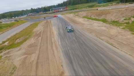 Premium Photo, Top view drifting car, aerial view professional driver  drifting car on race track.