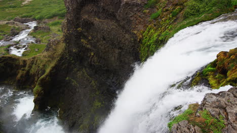 Overwatching-waterfall-stream-falling-down-steep-slope,-close-up-view