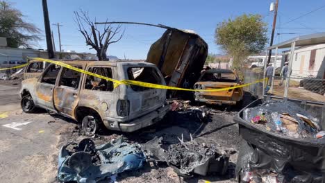 Multiple-vehicles-destroyed-by-trailer-fire-with-melted-trash-cans-nearby