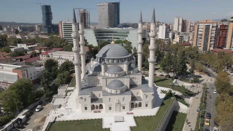 Aerial-orbits-bright-white-Namazgah-Islamic-Mosque-in-Tirana,-Albania