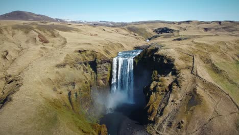 Aerial-Shot-Of-Fabulous-Waterfall,-Fresh-Water-Flowing-Out-Of-Mountains,-Iceland