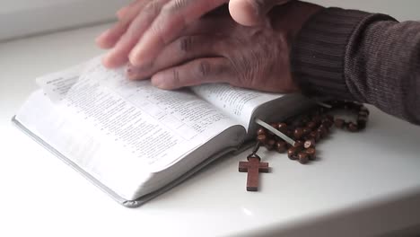 praying-to-god-with-hands-together-with-bible-and-cross-black-man-praying-with-black-background-stock-video-stock-footage