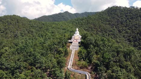 Big-Buddha-in-Pai,-Thailand-zoom-out-aerial-shot