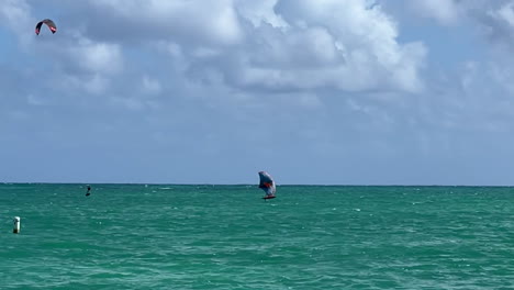 Two-windsurfers-at-Kailua-Beach-on-Oahu,-Hawaii