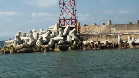 Leaving-Harbour,-Concrete-Coastal-Defence-Dolos-Example