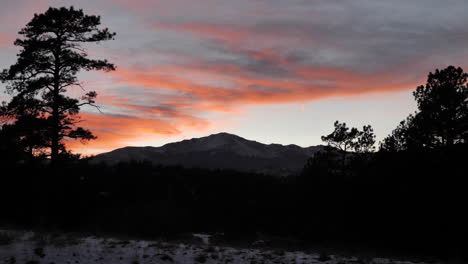 Wide-Shot-of-Sunset-over-Mountain-Range-in-Winter