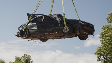 Poor-man's-car-destroyed-in-a-freak-accident-hanging-at-a-junkyard