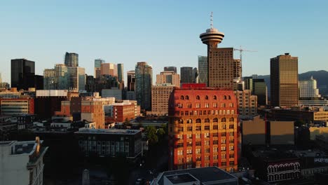 aerial-drone-footage-of-downtown-Vancouver-buildings,-gas-town,-early-sunrise,-morning-urban-view