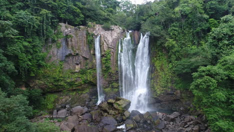 Aerial-moving-backwards-from-scenic-remote-Nauyaca-waterfalls-Costa-Rica,-4K