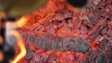 Glowing-Embers-From-A-Fire,-Firewood-In-Flame