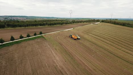 Bird's-Eye-View-Of-The-Farm-Trucks-Park-At-The-Bare-Field