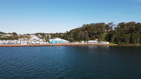 Fast-revealing-high-view-over-water-of-a-popular-scuba-diving-spot-the-pipeline-at-Nelson-Bay-Port-Stephens-NSW-Australia