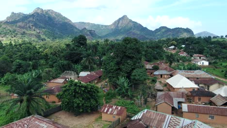 The-remote-settlement-of-Yashi,-Nigeria-in-the-Nasarawa-State-with-an-aerial-view-that-includes-rugged-mountains