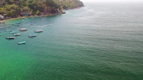Aerial-view-of-boats-and-coasline-of-Yelapa-town-in-Cabo-Corrientes,-Jalisco,-Mexico