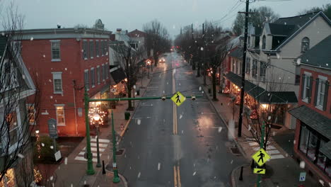 Store-lights-turned-on-in-early-morning-during-winter-snow
