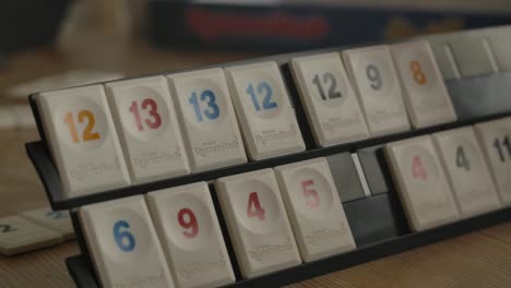 Close-up-view-of-person-playing-Rummikub,-filmed-handheld-in-4k