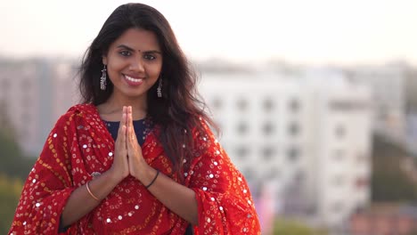 Traditional-Indian-girl-holding-hands-in-prayer-position-outdoor-in-4k