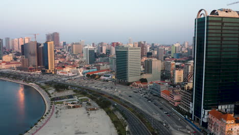 Traveling-front,-Luanda-city,-golden-hour-flying-over-Luanda-bay,-Africa-#5