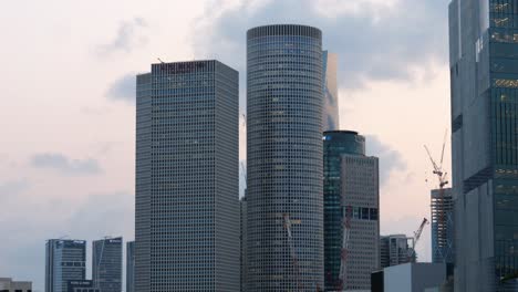 Close-up-of-modern-skyscrapers-in-Azrieli-Center-with-circular-tower,-Tel-Aviv-Israel