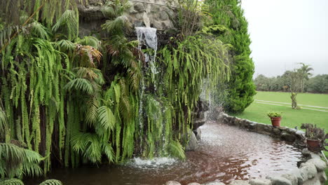 Static-shot-of-a-cascading-waterfall-feature-in-a-garden-in-Pachacamac,-Lima,-Peru
