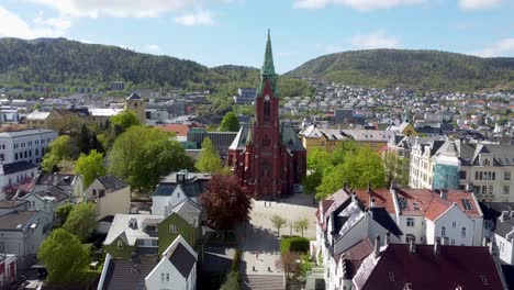 Aerial-approaching-the-huge-Johannes-Church-in-Bergen-Norway---Old-catholic-church-made-of-brick