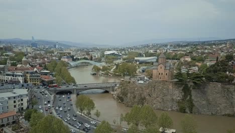 Tbilisi-aerial-view,-autumn-view,-no-sun,-cars-passing-by,-old-town,-glass-bridge