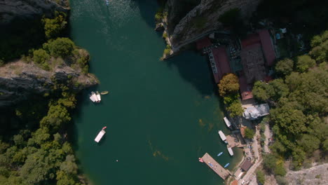 Top-view-of-circling-drone-over-river-in-Matka-canyon