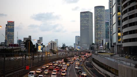 Dense-commuter-rush-hour-car-traffic-driving-into-the-city,-Tel-Aviv-Israel