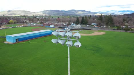 Aerial-view-of-stadium-lights-with-baseball-and-softball-fields-in-the-background