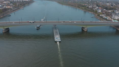 Drone---Aerial-shot-of-Kennedybücke-Kennedy-bridge-in-Bonn-with-the-river-rhine-and-ships-25p