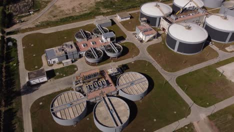 Aerial-top-down-shot-of-large-industrial-water-purification-plant-with-tanks-and-pools-in-Buenos-Aires---Storage,Sludge-Ecosystem-in-Argentina